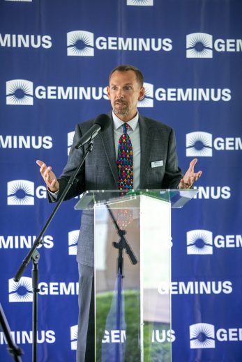 male leader speaking at podium